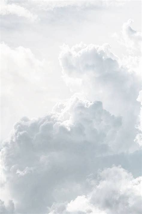 Airplane Flying Through the Cloudy Sky