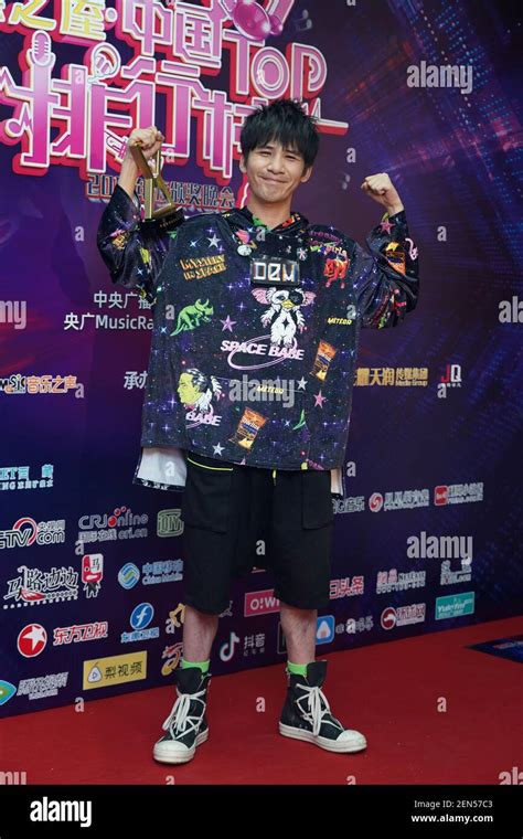 Chinese singer and actor Wowkie Zhang, also known as Da Zhang Wei, poses with his trophy after ...