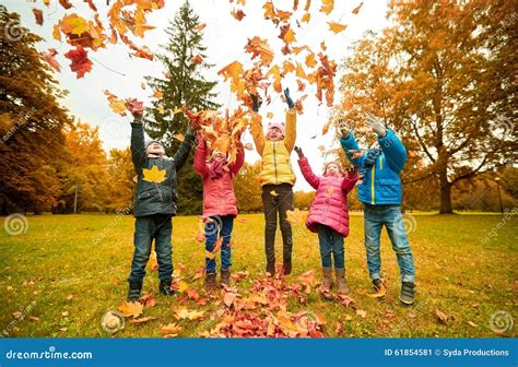 Happy Children Playing with Autumn Leaves in Park Stock Image - Image ...