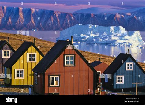 icebergs and colorful houses, Qaanaaq, Northwest Greenland Stock Photo ...