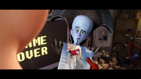 In Megamind (2010), Titan holds up a magazine, with Megamind's head ...