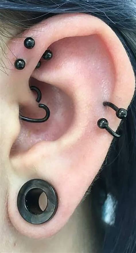 an ear with three black circles attached to it