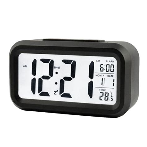 This LED digital clock can glow a soft white light when you press the ...