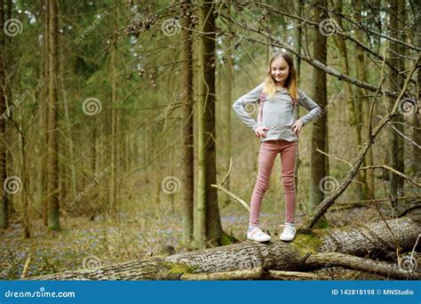 Cute Young Girl Having Fun during Forest Hike on Beautiful Early Spring ...