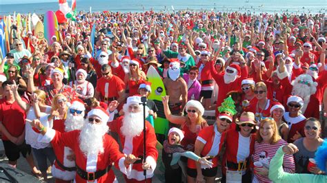 Live: Surfing Santas hit the waves for Florida Space Coast tradition