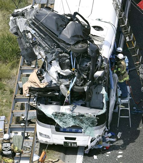 1 dead, 45 injured after car rams into tour bus on expressway