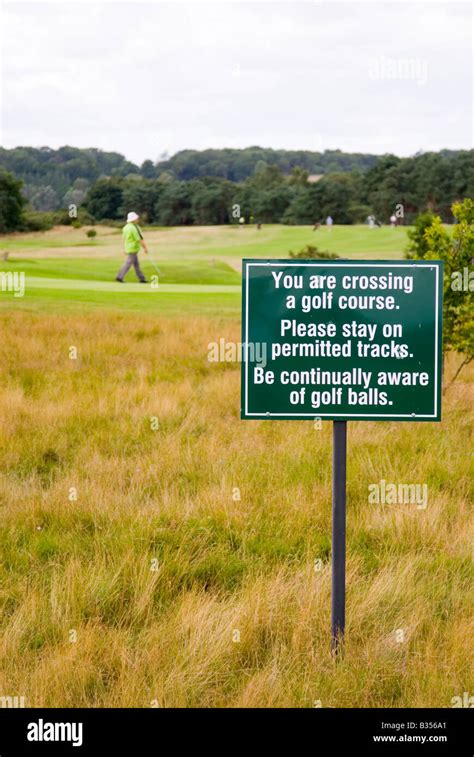 Warning sign on golf course Stock Photo - Alamy