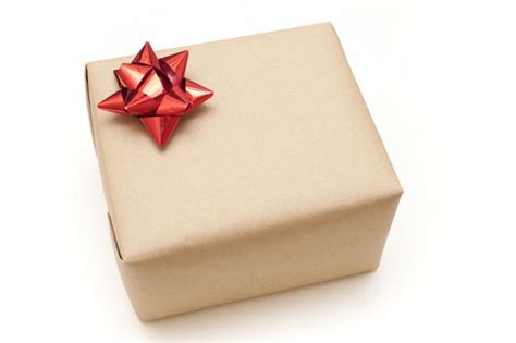 Photo of Plain brown paper wrapped gift box | Free christmas images