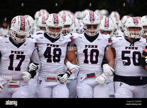 Penn Quakers players enter the field at the start of the NCAA football ...