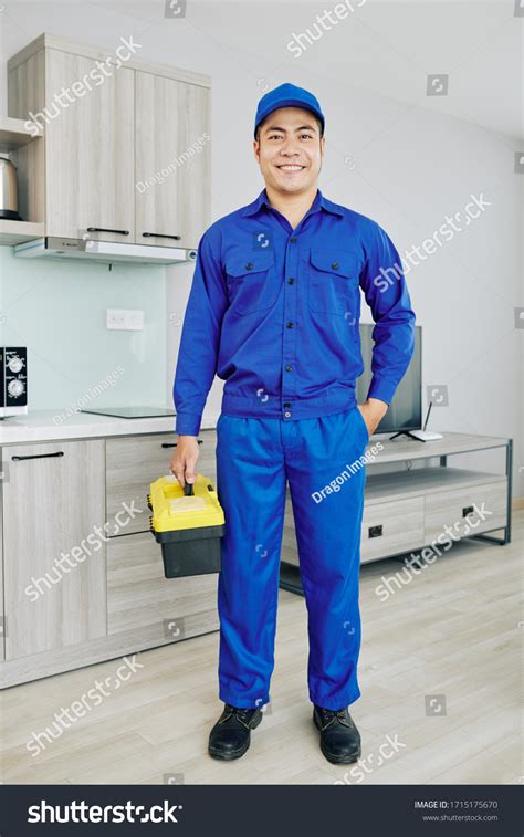 Smiling Asian Handyman Blue Uniform Holding Stock Photo 1715175670 ...