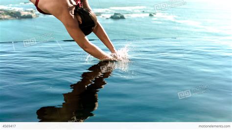 Woman Diving Into The Water In Slow Motion Stock video footage | 4569417