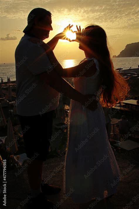 silhouette of couple at sunset Stock Photo | Adobe Stock