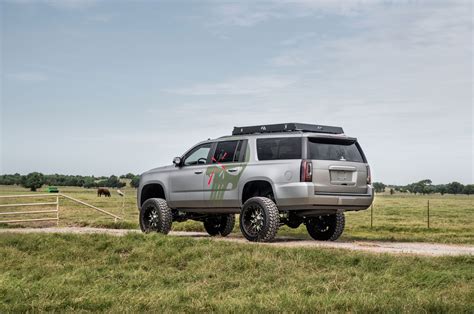 Off-road Modified GMC Yukon XL with Mud Tires and Roof Rack — CARiD.com ...