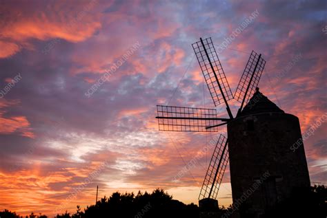 Windmill at sunset - Stock Image - C056/5996 - Science Photo Library