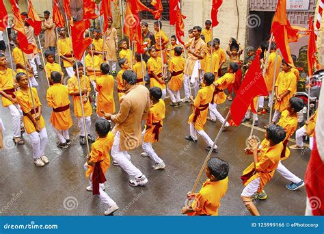 PUNE, INDIA, August 2017, Group of Small Boys, Dancing with Flags, during Ganapti Procession ...