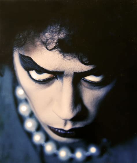 Dramatic portrait of Tim Curry as Dr. Frank-N-Furter, taken by Mick Rock. This photo has seen ...