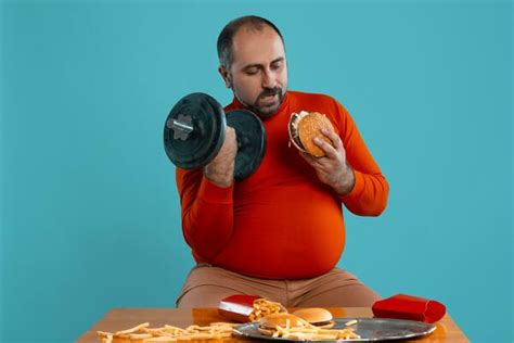 Fat Man Eating Stock Photos, Images and Backgrounds for Free Download