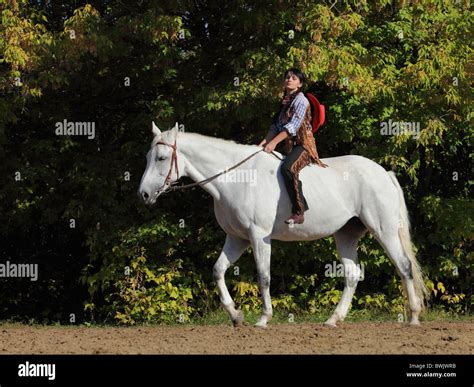 Young western girl with her horse Stock Photo - Alamy