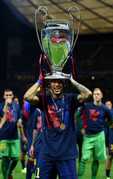 Neymar of Barcelona celebrates with the trophy after the UEFA Champions League Final between ...