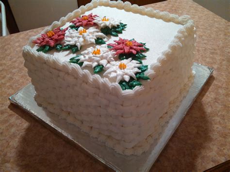 Made this 10 inch square cake with royal icing poinsettia's. This is my ...