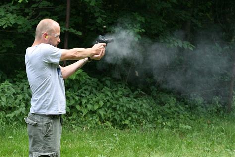 man shooting a gun Free Photo Download | FreeImages