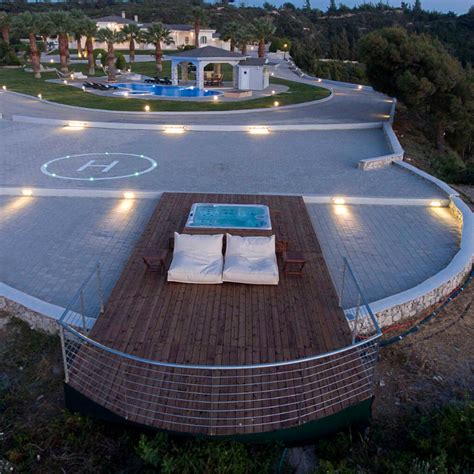 From Sardinia to Costa Rica: a lakefront house with a floating helipad ...