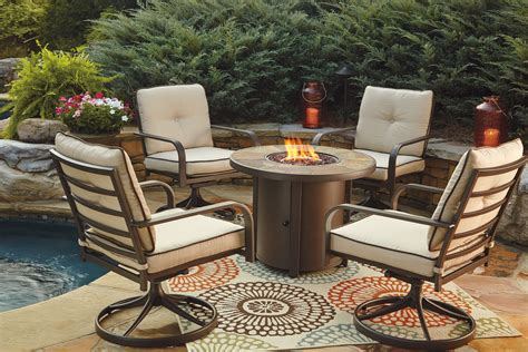 Predmore Beige and Brown Outdoor Round Fire Pit Table from Ashley ...