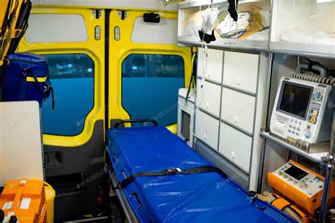 Interior of ambulance car with stretcher, refrigerator and medical ...