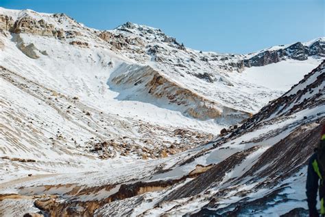 Stunning snowy mountains under blue sky with few clouds · Free Stock Photo