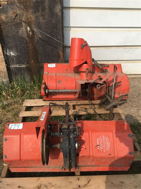 2 Simplicity garden tractor attachments: Rototiller & snow blower plus grain bin dolly