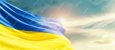 Premium Photo | Ukraine waving flag in beautiful sky.