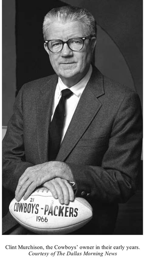 a man in a suit and tie holding a football with the words cowboys ...