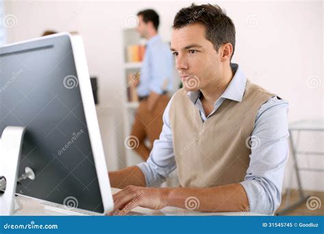 Smart Guy Working In Office Stock Image - Image: 31545745