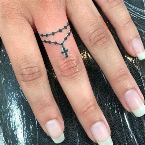 Image result for cross tattoo finger Wing Tattoos On Wrist, Angel Wing Finger Tattoo, Cross ...