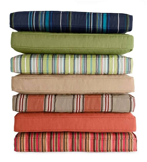 four pillows stacked on top of each other with different colors and ...