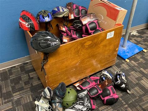 Wheeled Wood Storage Box w/Assorted Rollerblades & Safety Gear - Gavel Roads Online Auctions