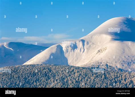 Snowy sunrise mountain landscape Stock Photo - Alamy