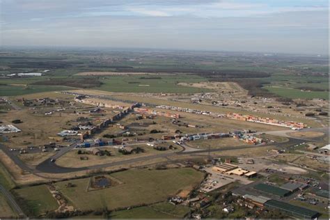 The old runways at the former RAF Alconbury are now packed with loads of cars, lorries and ...