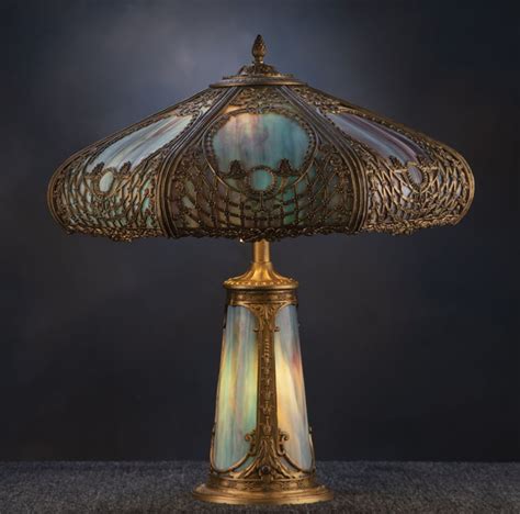 A beautiful antique curved glass, stained glass Table Lamp, circa 1920-1925, attributed to The ...