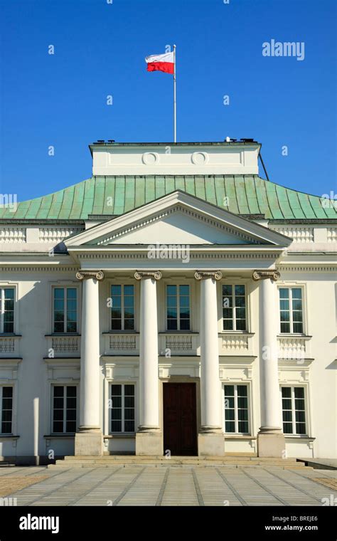 Belweder Palace former Polish Presidents house with Polish flag waving on the roof top Stock ...