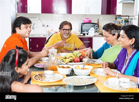 Indian Family Dining Table Eating Food Lunch At home Stock Photo: 158301394 - Alamy