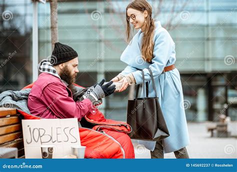 Woman Giving Food To a Homeless Beggar Stock Image - Image of beggar, bench: 145692237