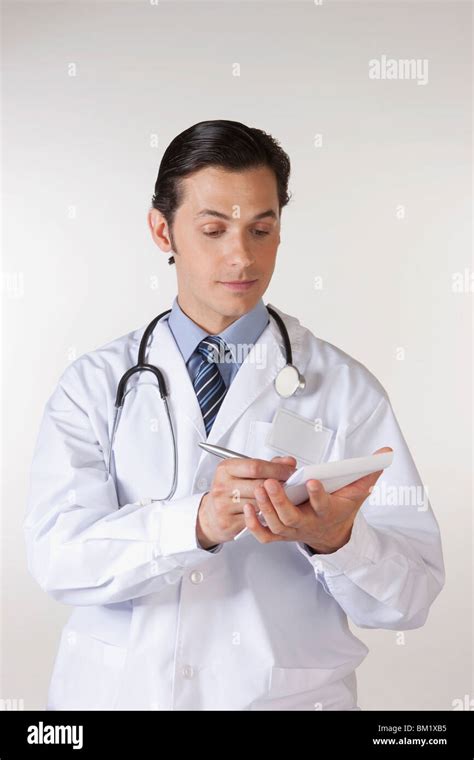 Doctor writing a prescription Stock Photo - Alamy