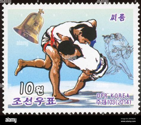 2014 North Korea stamp. Korean Folk Customs (Holiday Games). Ssireum, Korean Wrestling Stock ...