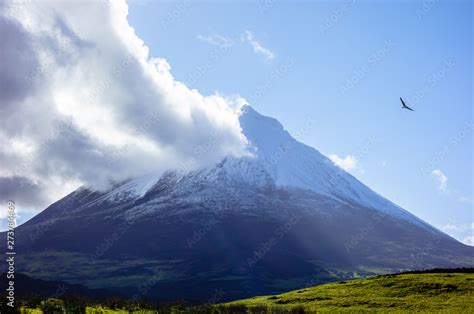 Mount Pico volcano with cloud touching summit. Stock Photo | Adobe Stock