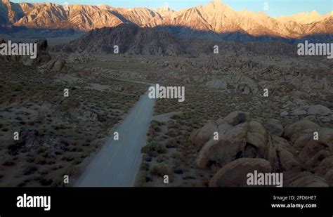 Cinematic Aerial View on Desert Road and Alabama HIlls in Owens Valley ...