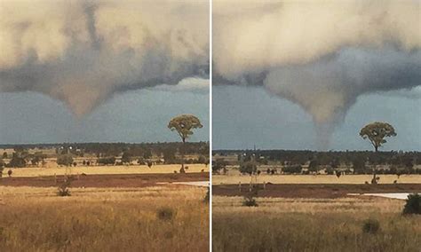 Farmer captures 'tornado dropping out of cloud' sending debris flying ...