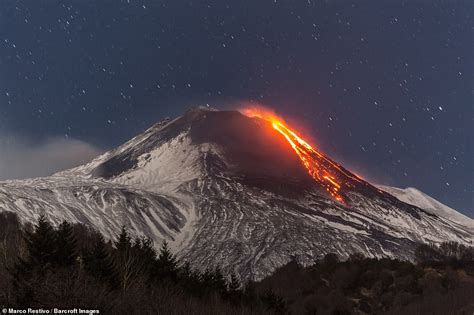 Incredible pictures capture moment Mount Etna erupts sending lava into ...