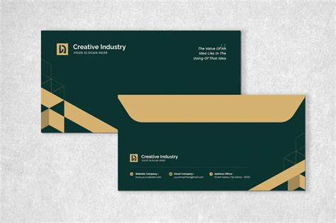 two green and gold business cards sitting on top of a white surface ...