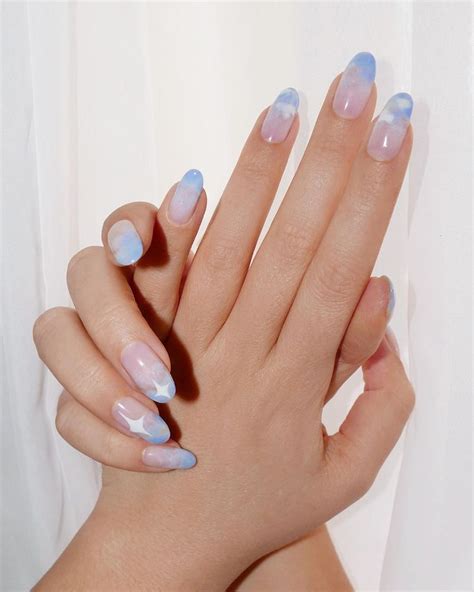 Cloud nail art is the dreamiest design for your first manicure of the new year — and we've ...